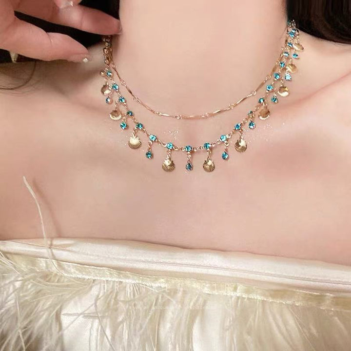 Versatile women's elegant gemstone necklace, delicate design with a shimmering shell color stone.