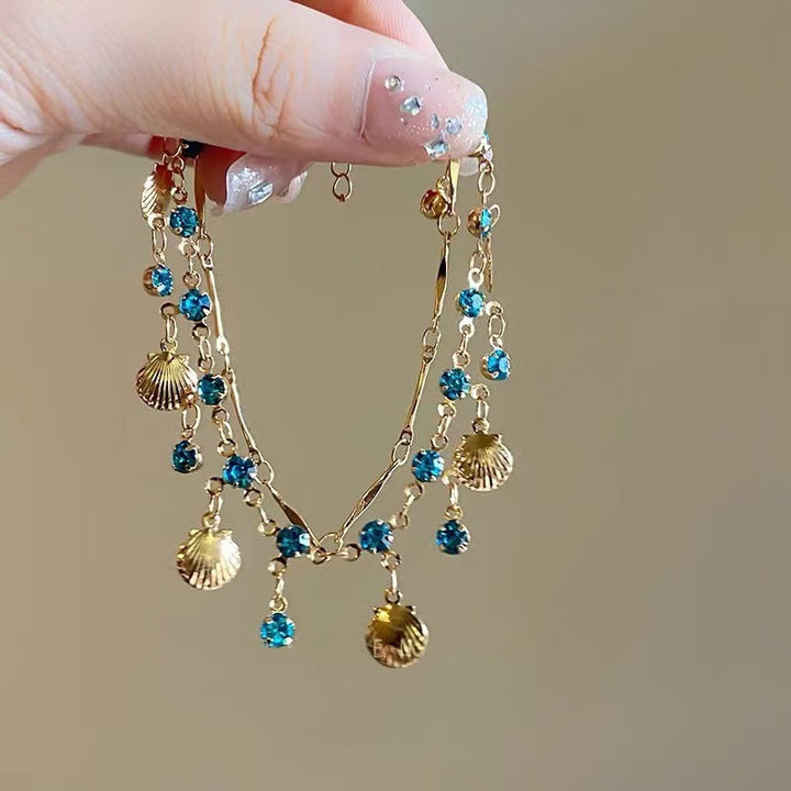 Statement women's necklace featuring an elegant shell color gemstone, dazzling and fashionable.
