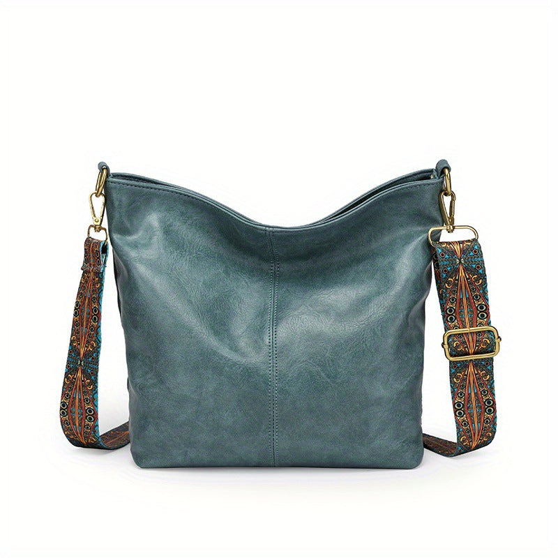 Versatile women's leather handbag, large storage for travel or daily essentials.