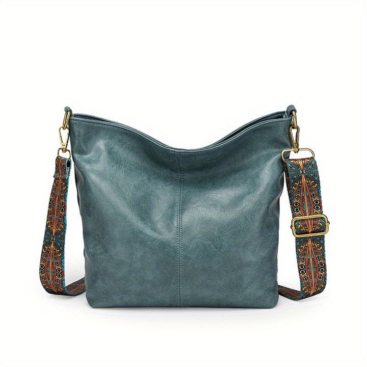 Versatile women's leather handbag, large storage for travel or daily essentials.