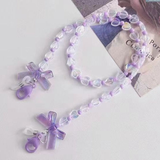 Elegant women's glasses chain with delicate heart & flower charms. Perfect eyewear holder for sunglasses or reading glasses.