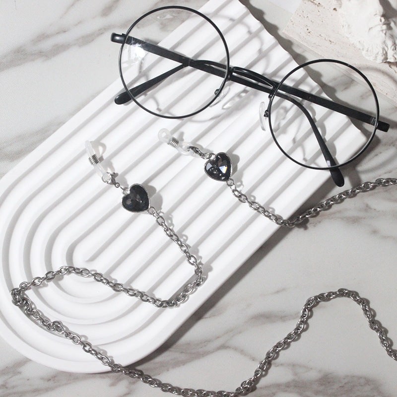 Elegant women's glasses chain with delicate heart pendants. Stylish eyewear holder for reading glasses & sunglasses.