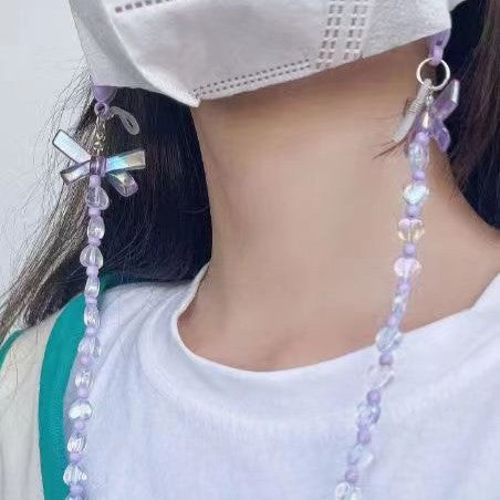Chic lilac glasses chain for women, featuring dainty heart and flower designs. Stylish fashion accessory & eyewear holder.
