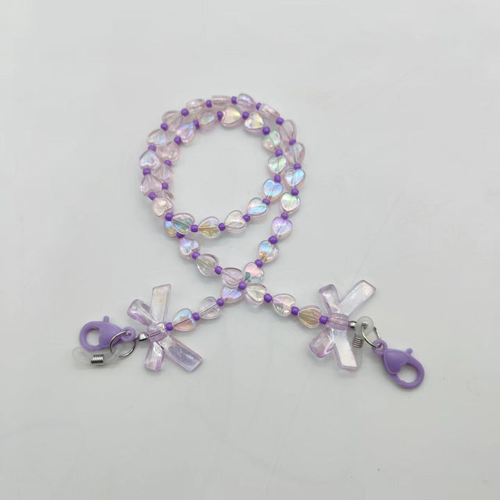 Women's accessory: delicate glasses chain with sweet heart and flower charms. Keeps eyewear close, adds a chic touch.