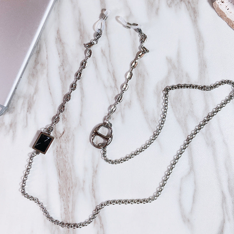 Elegant women's glasses holder chain with a sleek stainless steel rectangular pendant, perfect eyewear accessory.