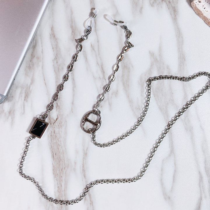 Elegant women's glasses holder chain with a sleek stainless steel rectangular pendant, perfect eyewear accessory.