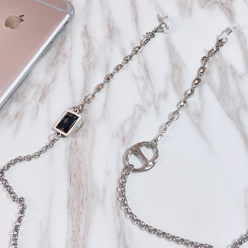 Fashionable eyeglass necklace for women. Elegant stainless steel chain with rectangular pendant keeps glasses secure & stylish.