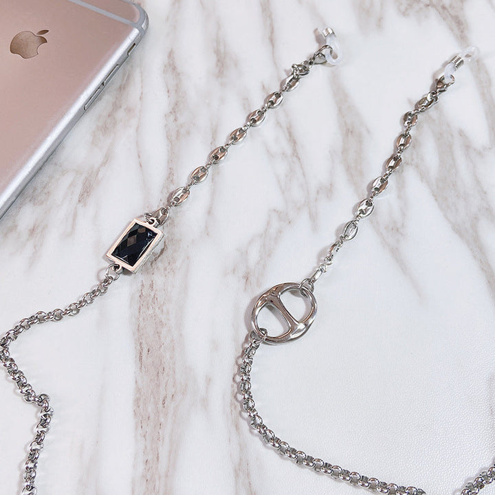 Fashionable eyeglass necklace for women. Elegant stainless steel chain with rectangular pendant keeps glasses secure & stylish.