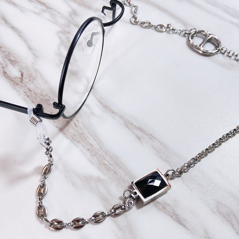 Sophisticated women's glasses holder chain. Stainless steel jewelry with elegant rectangular pendant, ideal fashion gift for her.