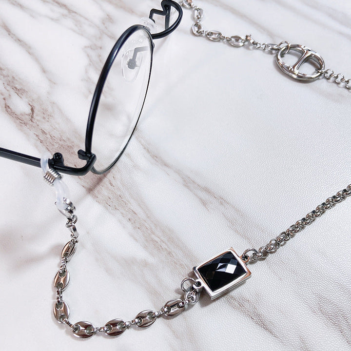 Sophisticated women's glasses holder chain. Stainless steel jewelry with elegant rectangular pendant, ideal fashion gift for her.