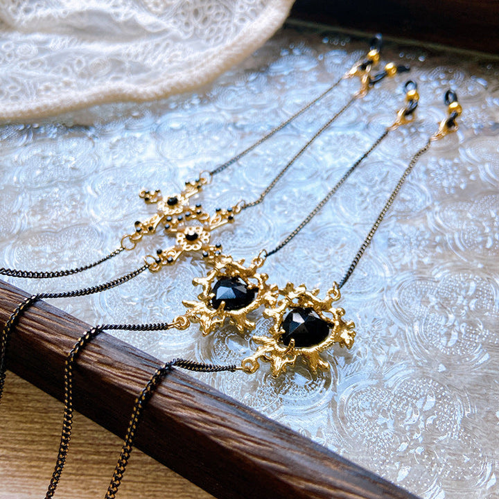 Women's gold finish necklace featuring elegant heart and cross stone pendants. Stylish jewelry gift for her.