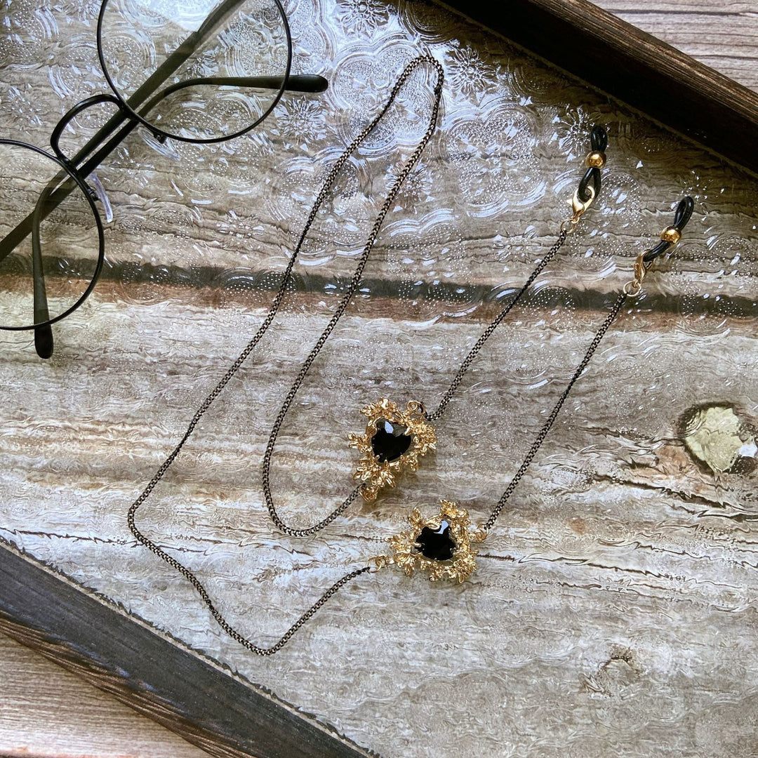 Delicate gold finish women's necklace adorned with various elegant stone pendants. Beautiful jewelry for her.