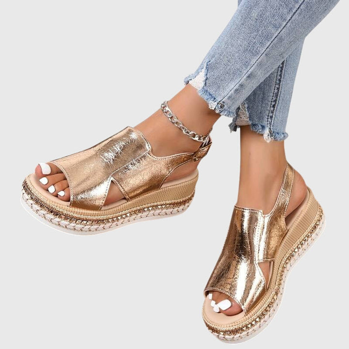 Gold women's flat orthopaedic sandals, stylish and supportive. Perfect for elegant, comfortable summer wear.