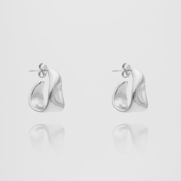 Delicate women's gold textured half hoop earrings, adding a touch of sophistication.