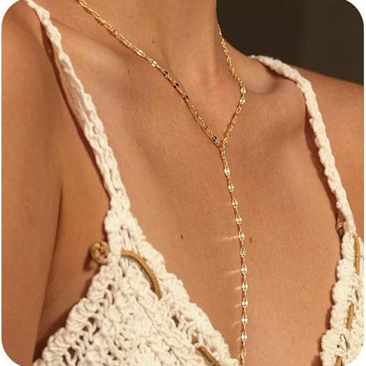 Women's elegant gold Y-chain lariat necklace, a perfect fashion accessory worn by model.