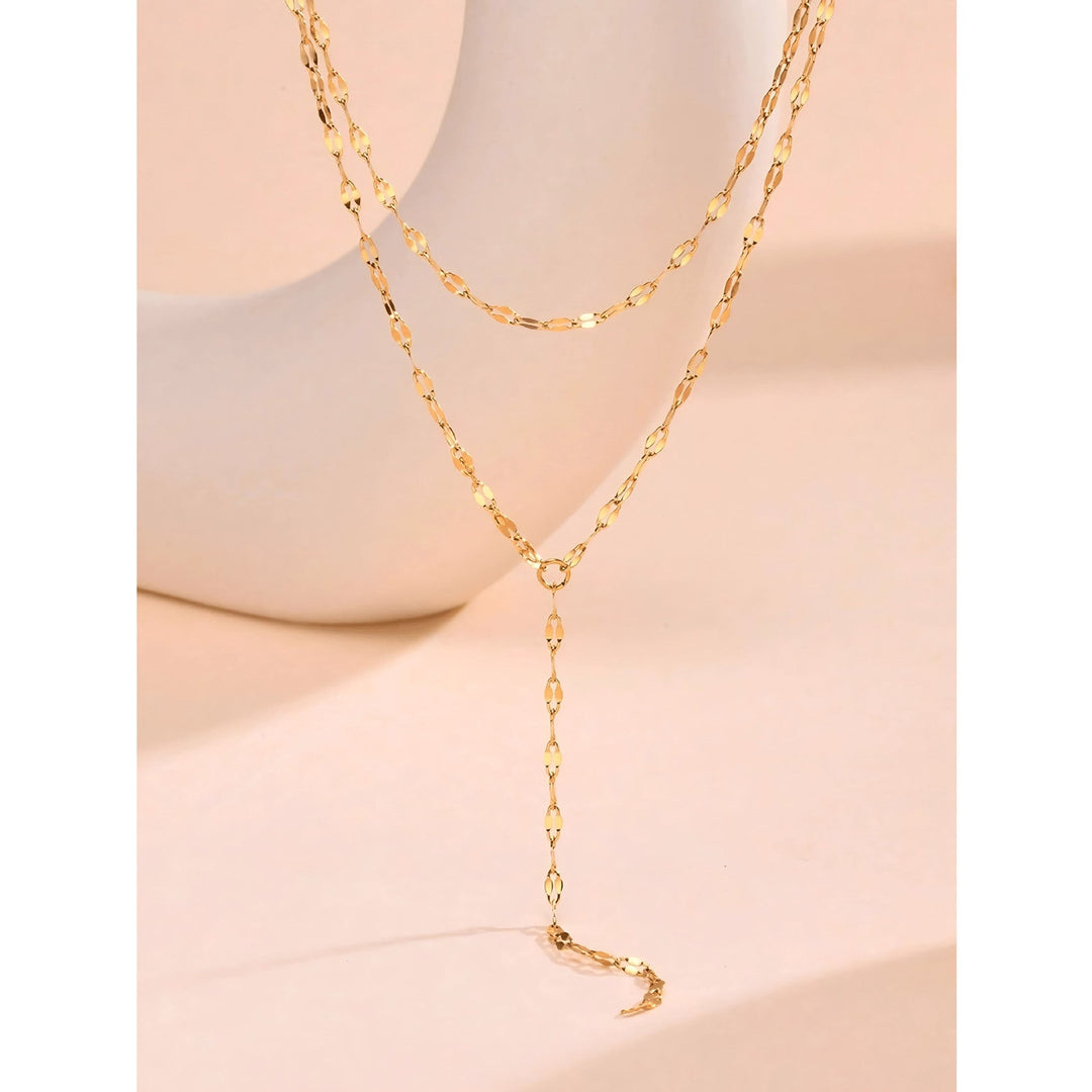 Long, elegant gold Y-chain lariat necklace for women, a fashionable jewelry piece.