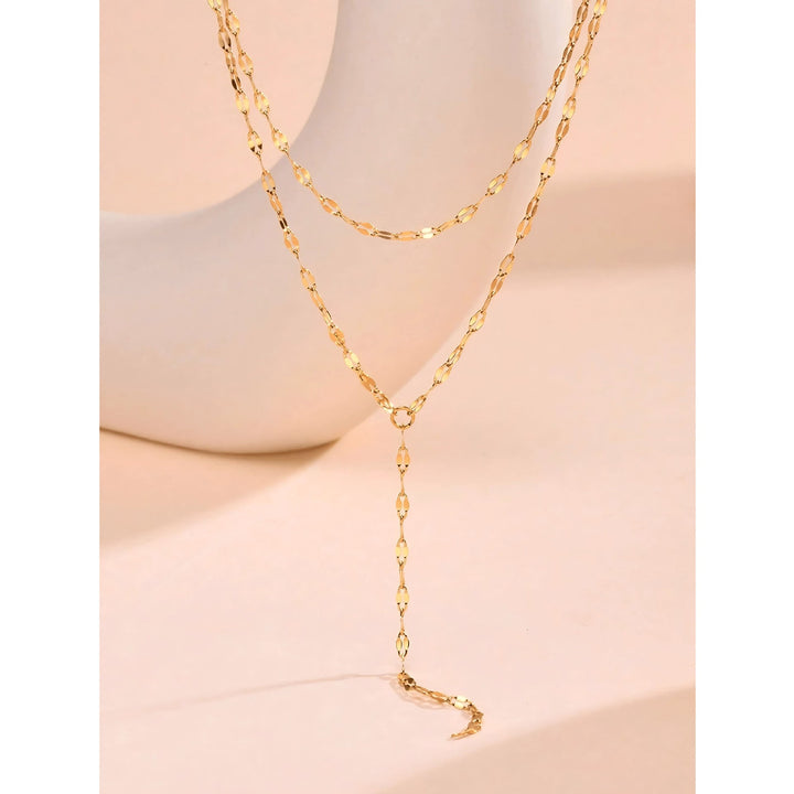 Long, elegant gold Y-chain lariat necklace for women, a fashionable jewelry piece.