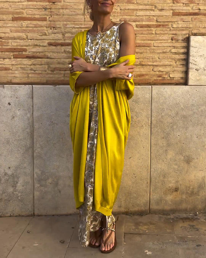 Women's elegant golden maxi dress with a flowing silhouette, perfect for evening, party, or special summer occasions.