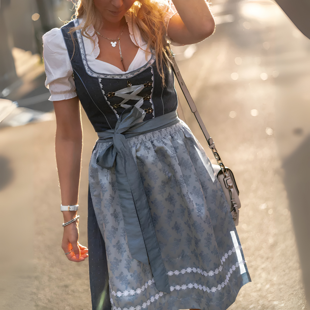 Elegant women's gray traditional Dirndl dress, perfect for Oktoberfest or any festive cultural event. Authentic folk attire.
