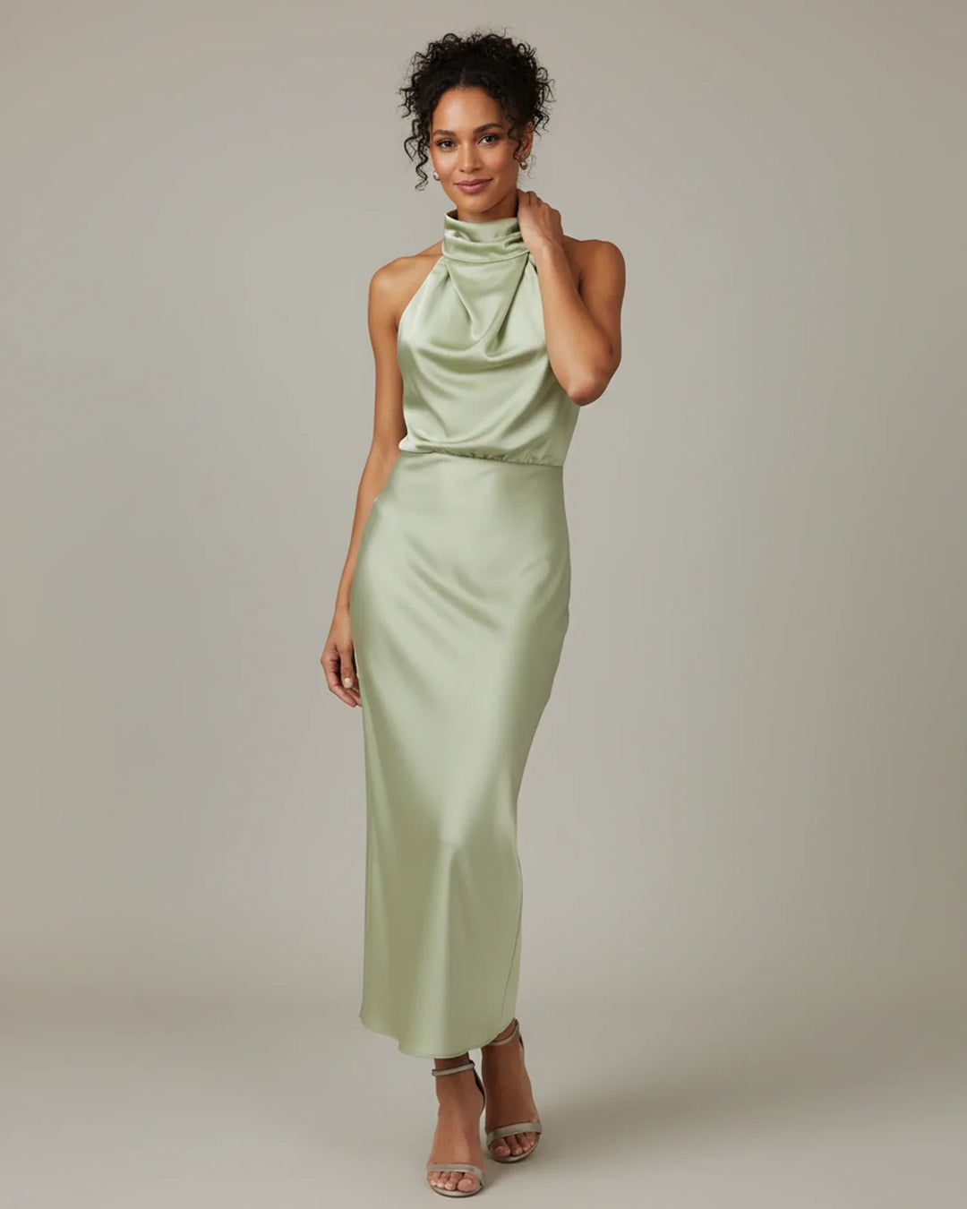 Feminine halter neck slip midi dress for women, ideal for elegant wedding guest attire or summer parties.