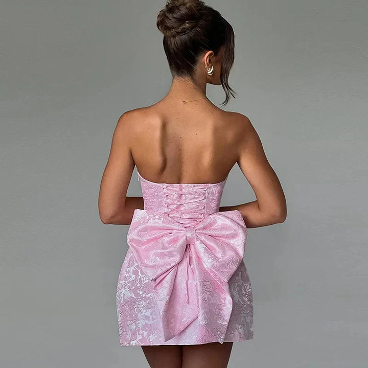 Chic white halter midi dress, an elegant women's cocktail or formal evening wear option.
