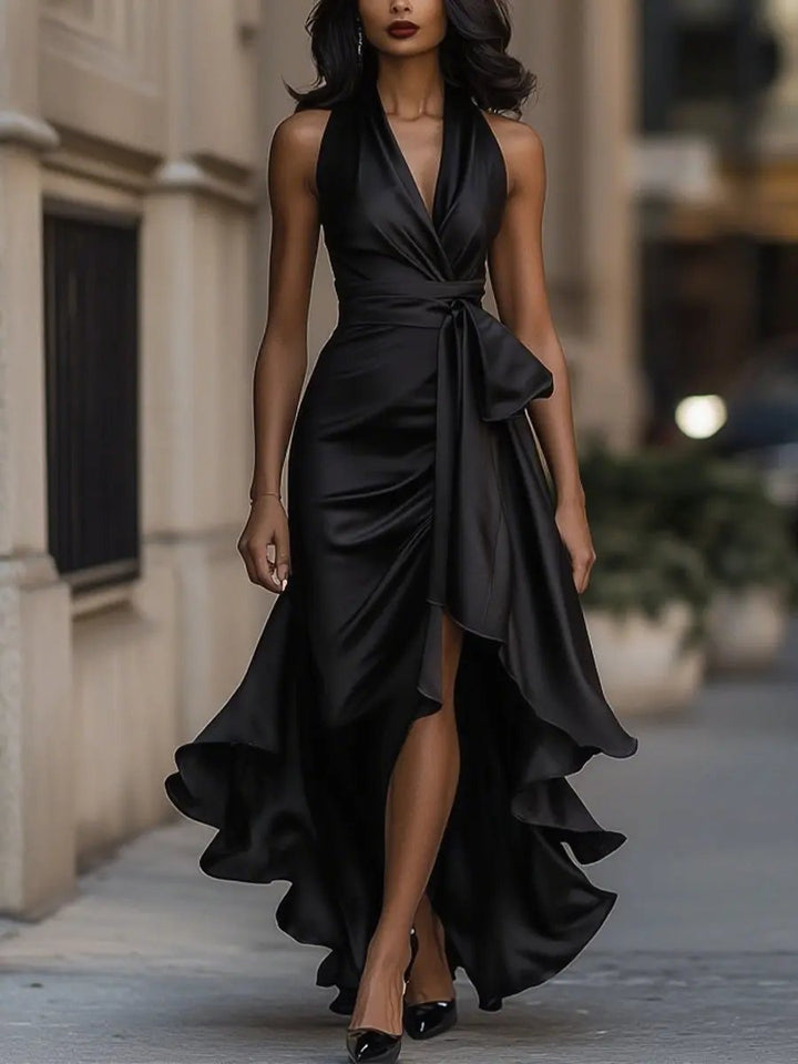 Flowy women's halter high-low dress with ruffles, a stylish wrap design for evening events.