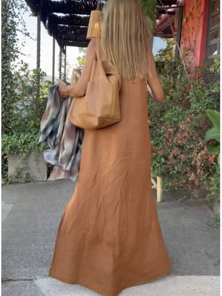 Back view of a women's elegant halter maxi dress. Perfect summer outfit for parties, beach, or vacation. Flowy design.