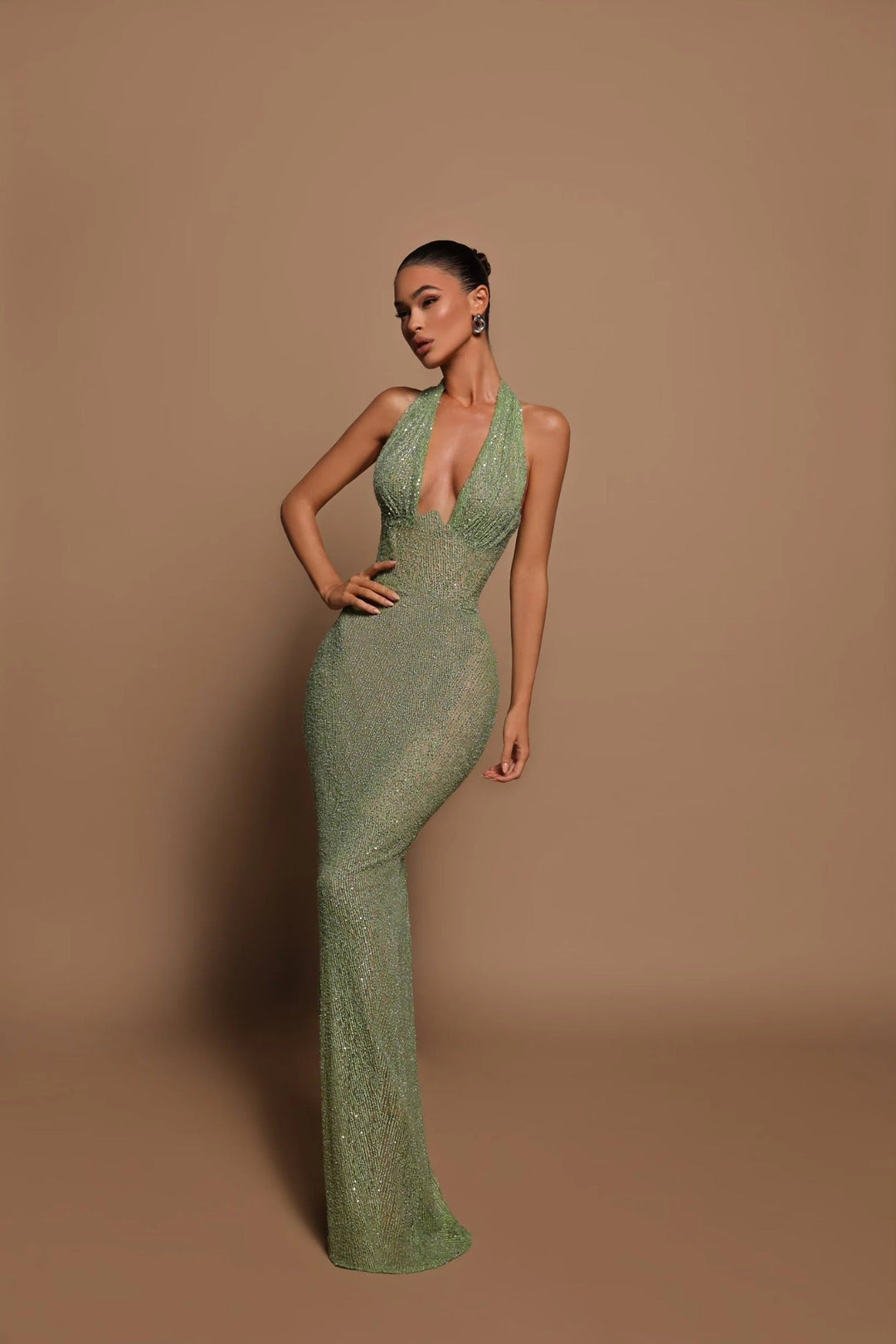 Sophisticated green halter neck maxi dress for women, featuring a chic open back design.