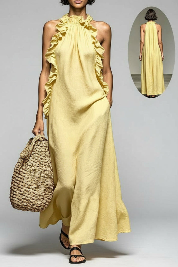 Flowy sleeveless halter maxi dress for women, featuring elegant ruffle trim, ideal for beach or resort.