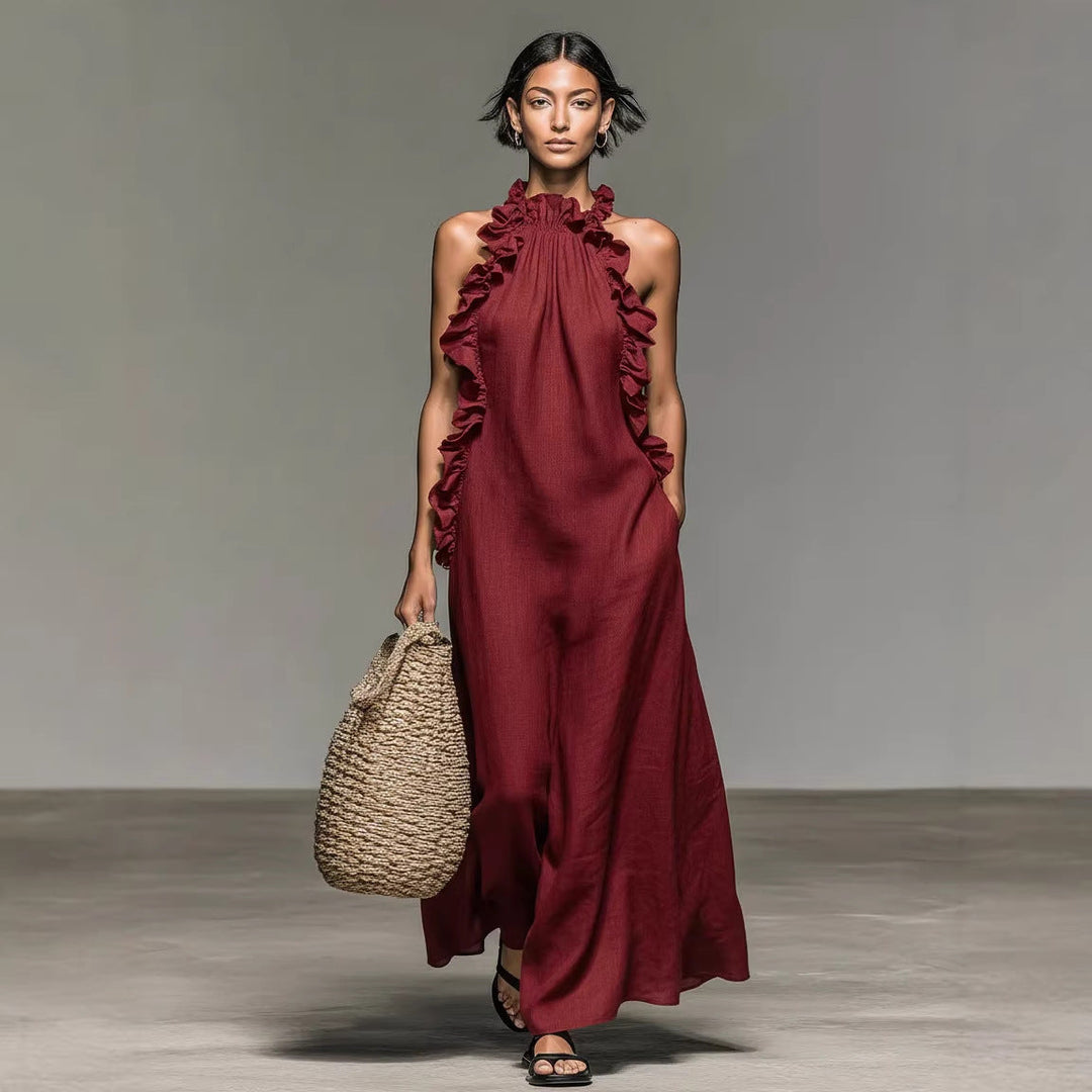 Women's sleeveless flowy maxi dress, halter style, with elegant ruffle trim, great for vacation outfits.