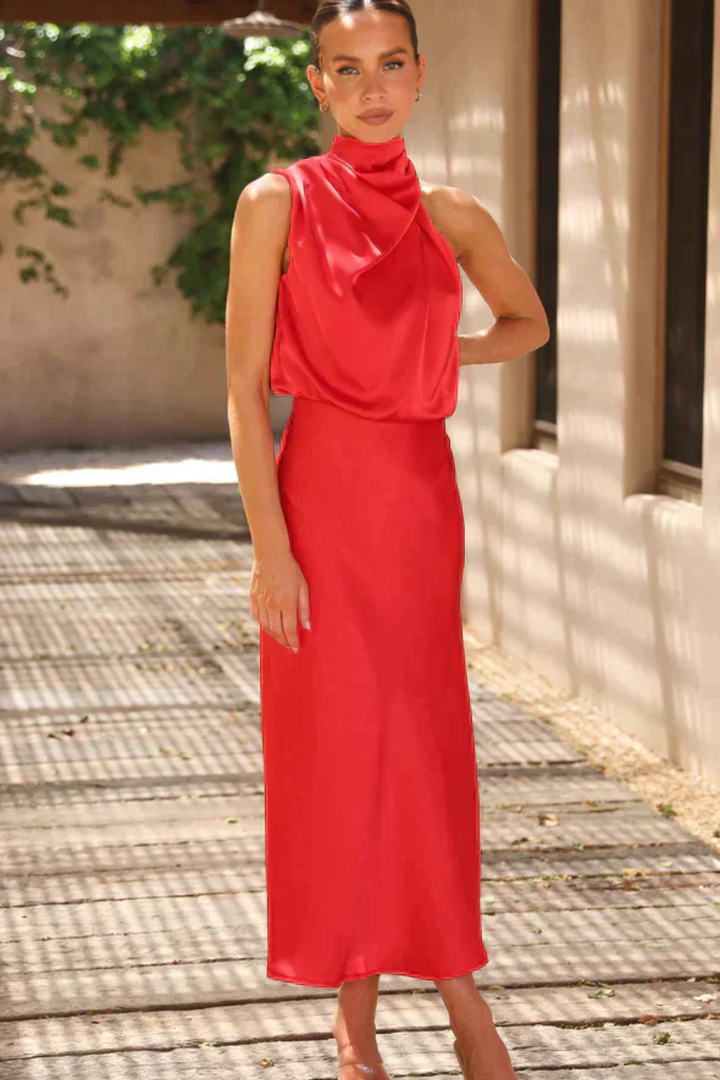 Chic sleeveless halter midi dress, an elegant choice for special occasions and formal gatherings.