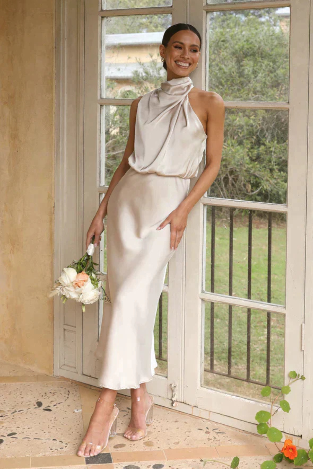 Chic sleeveless halter neck midi dress, ideal as an evening gown or special occasion cocktail.