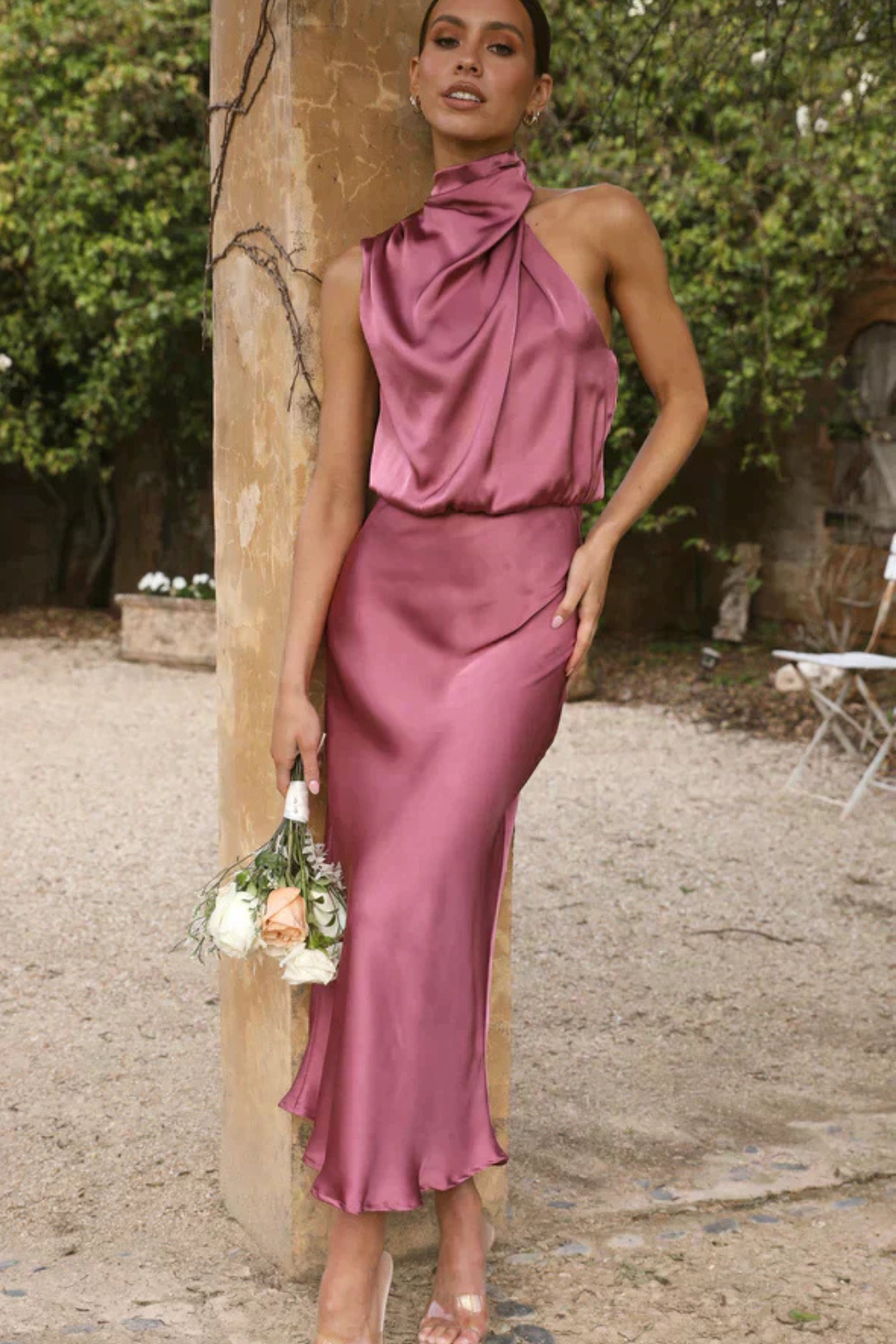 Wedding guest halter neck midi dress, elegant & fluid, perfect for formal and cocktail events.