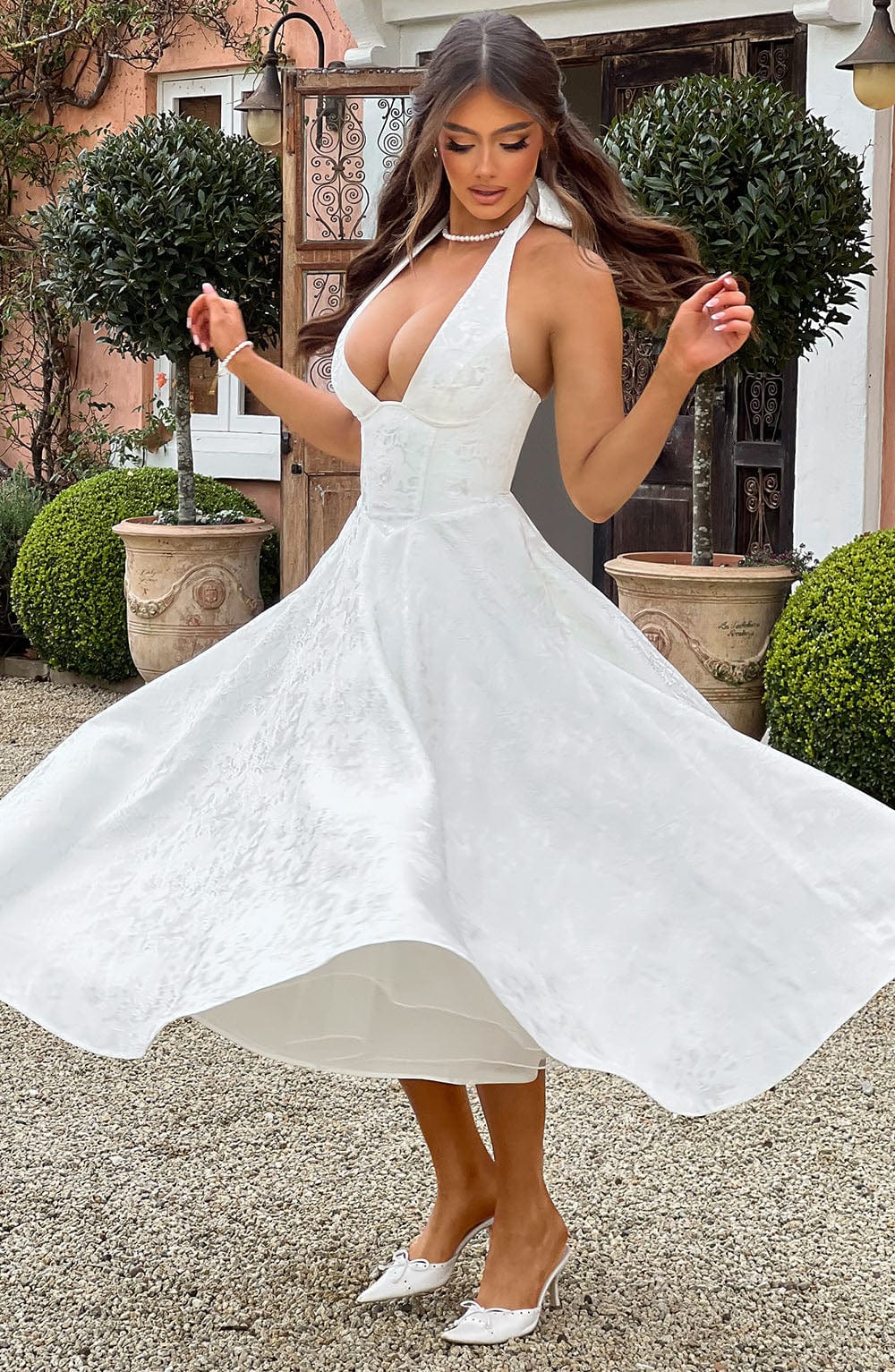 Formal women's halter midi dress with elegant design, ideal for special occasions.
