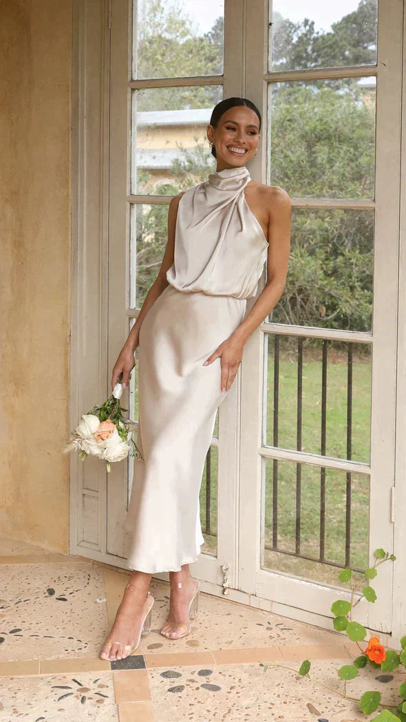 Elegant women's halter midi dress with a stylish draped neckline, perfect for summer occasions.