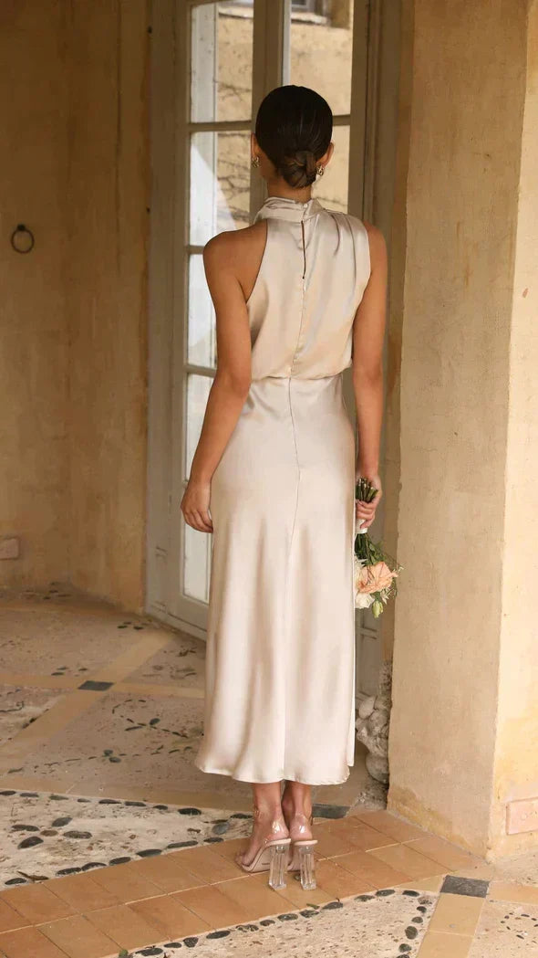 Sophisticated women's midi halter dress with draped neckline, ideal for evening parties & formal events.