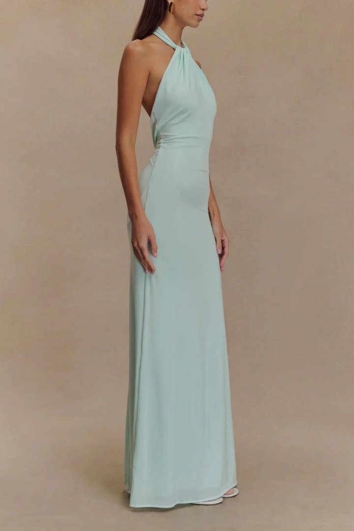 Stylish women's formal halter neck maxi dress featuring a unique twisted knot design and alluring open back.