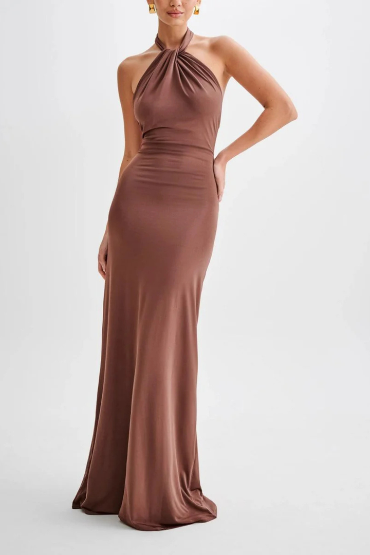 Feminine women's halter neck bodycon maxi dress featuring a stylish twisted knot, open back, ideal for evening events.