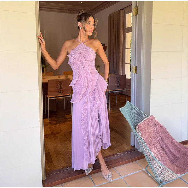 Elegant women's halter neck floral maxi dress, perfect for summer events or vacation. Flowy, sophisticated style.