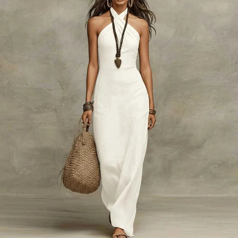 Elegant women's halter neck flowy maxi dress in a vibrant color, perfect for summer parties & evening events.