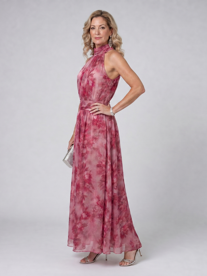 Sophisticated sleeveless halter neck midi dress for women. Flowing fabric ensures comfortable, chic summer wear.