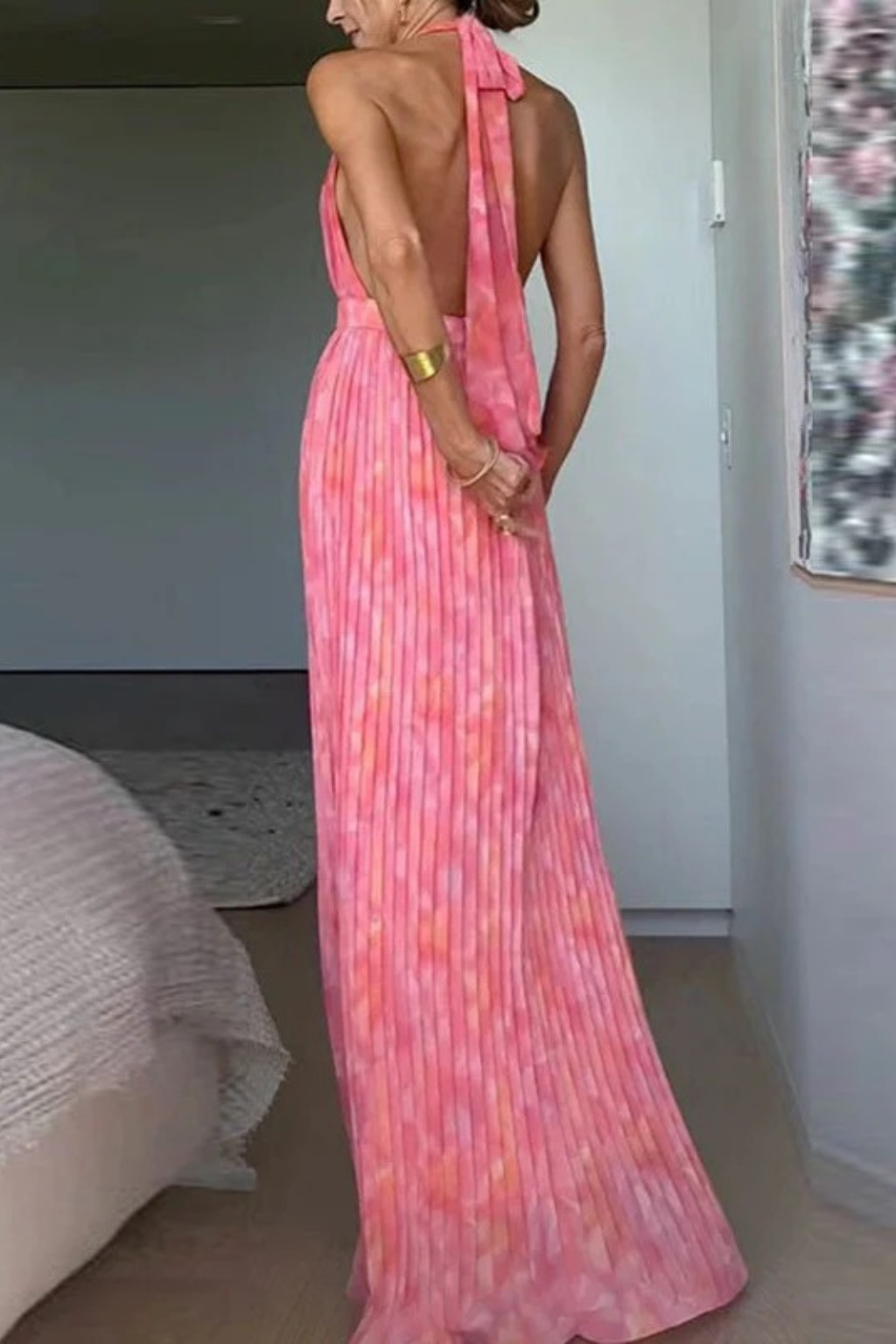 Beautiful pleated maxi dress for women, featuring a halter neck, perfect for elegant evening wear & formal occasions.