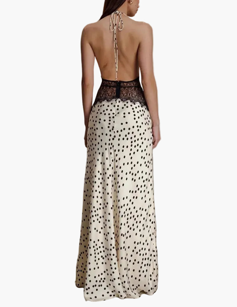 Chic women's polka dot pattern maxi dress with a halter neck, suitable for party or casual summer looks.