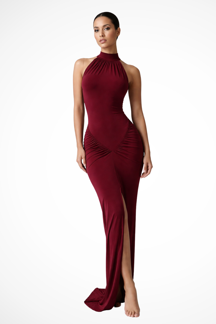 Sophisticated women's sleeveless maxi dress, featuring an elegant halter neck, subtle ruching & front slit.