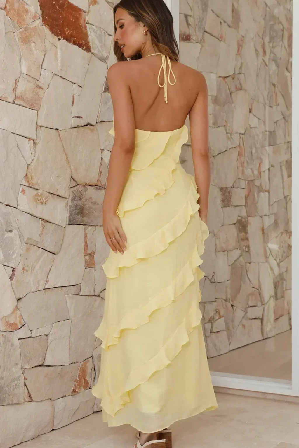 Long women's ruffle maxi dress with a stylish halter neck, great for summer elegance.