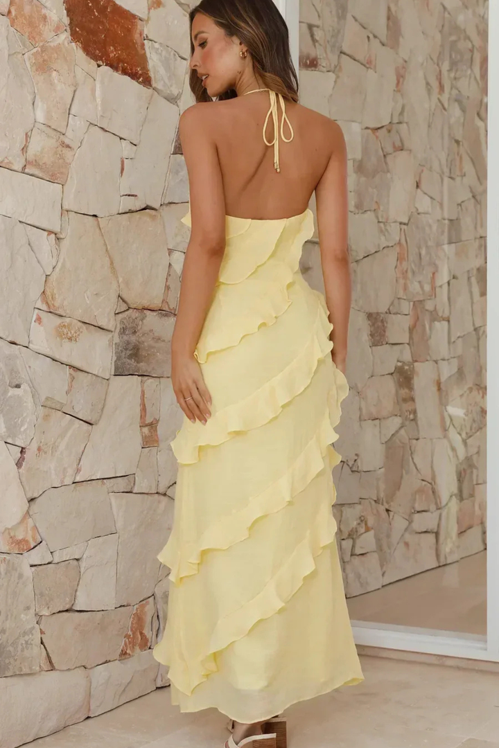 Long women's ruffle maxi dress with a stylish halter neck, great for summer elegance.