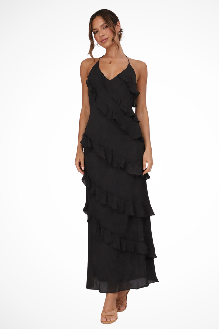 Beautiful women's halter neck summer maxi dress with ruffles, a versatile vacation outfit.