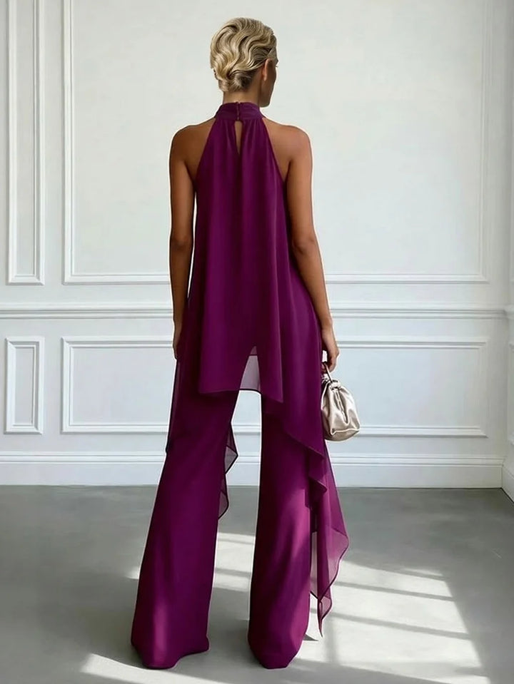 Stylish women's halter neck top paired with flowing wide-leg trousers, a perfect comfortable co-ord set.