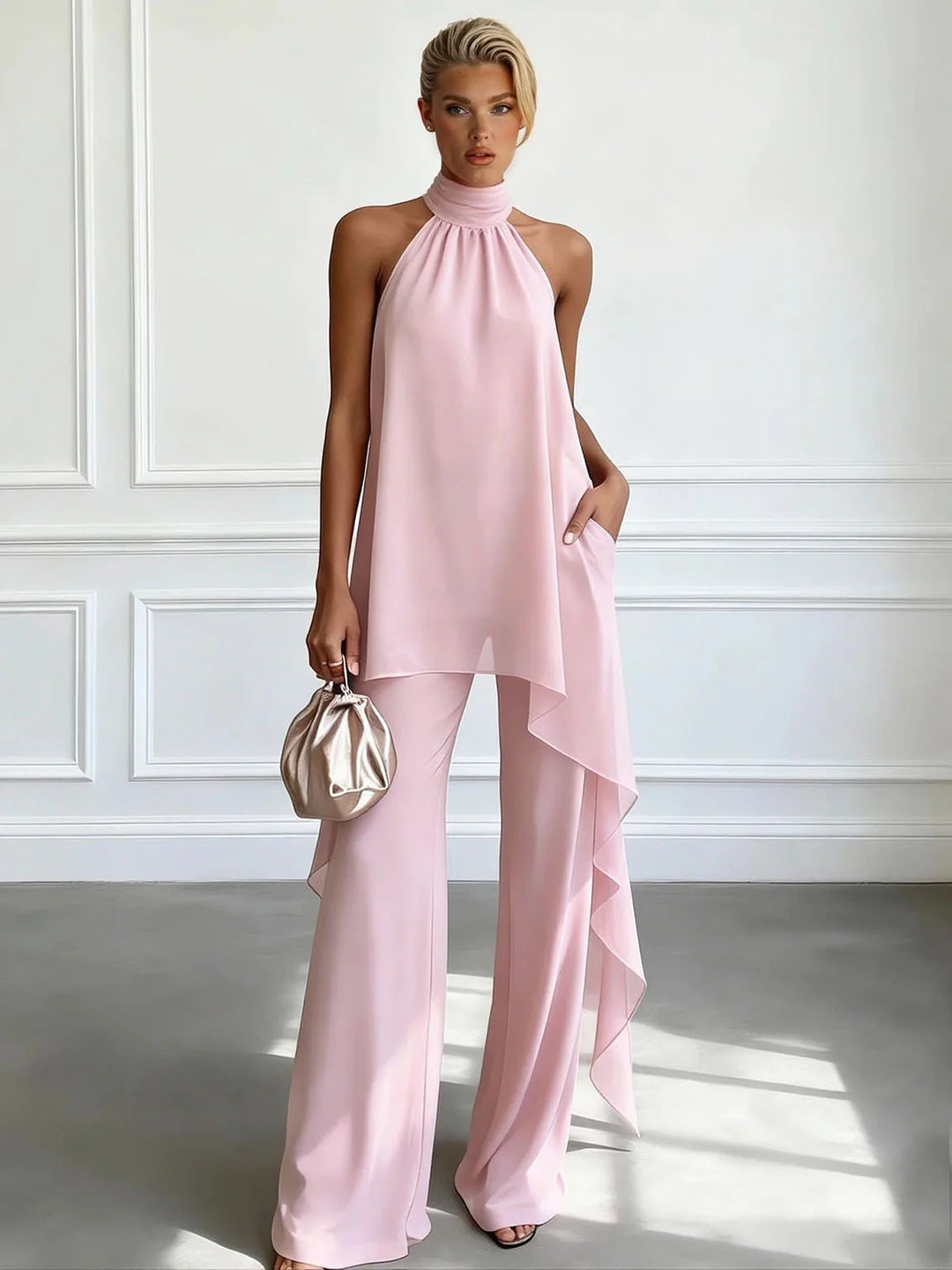 Modern women's halter neck top & wide-leg trousers set, an elegant summer fashion statement co-ord.