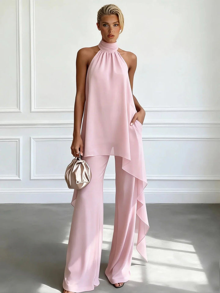 Modern women's halter neck top & wide-leg trousers set, an elegant summer fashion statement co-ord.